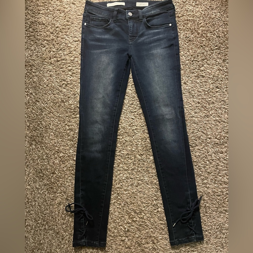 Anthropologie skinny jeans. Size 26. Dark denim with lace on ankles.